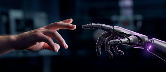 k4_24707974 Human hand reaching toward a robotic hand with a purple glow, symbolizing human–robot collaboration in a tech setting.