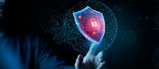 Hand reaching toward a glowing shield with a red lock, symbolizing cybersecurity protection.